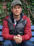 James Norton Nowhere Special 2024 John Grey And Red Hooded Jacket.